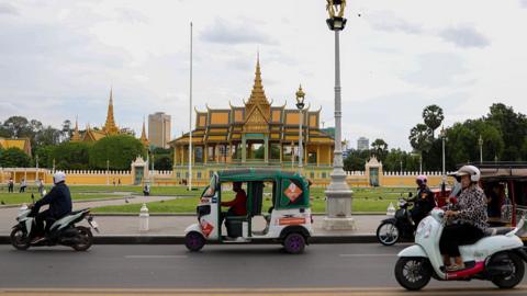 Vehicles drive past Royal Palace of Cambodia in Phnom Penh, Cambodia on 25 July 2025.