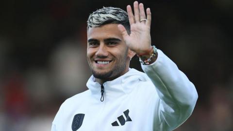Fulham midfielder Andreas Pereira waves to the crowd