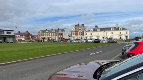 North Street in Seaham with cars parked in front of some posh houses 