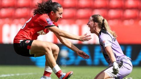 Charlton goalkeeper Sophie Whitehouse celebrates with team-mate Lucia Lobato