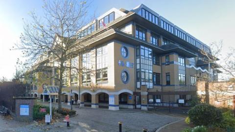 An external view of Horsham District Council's offices on a sunny day.