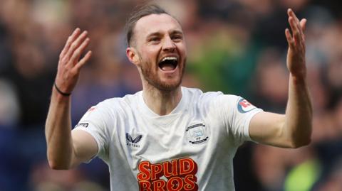 Will Keane celebrates scoring a goal for Preston North End 
