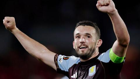 John McGinn celebrates scoring against Feyenoord in the Europa League