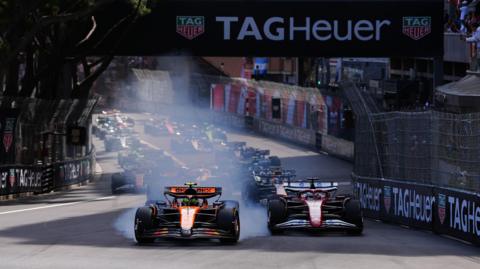 Lando Norris locks up a wheel as he leads into the first corner of the 2025 Monaco Grand Prix