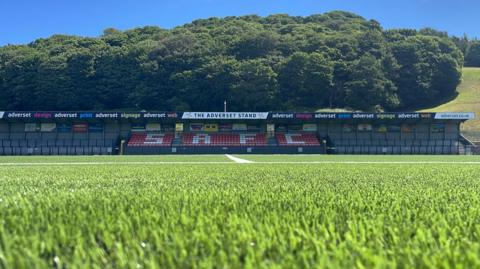 Scarborough Athletic's ground at Scarborough Sports Village. With lush green grass with the club's stand at the rear