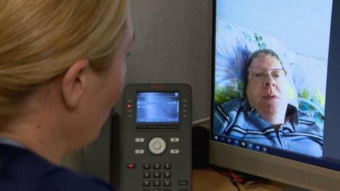 Nurse Pauline Kerray uses the NHS Near Me video call system to chat to Derek White at his Uddingston home to determine if he needs to make the 13-mile trip to the QEUH emergency ward in person