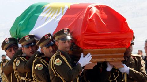 The coffin of former Iraqi president Jalal Talabani is covered with a Kurdish flag at Sulaimaniya Airport, Iraq on 6 October 2017