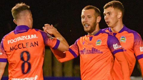 Kirk Millar celebrates scoring Linfield's second goal at Lakeview Park