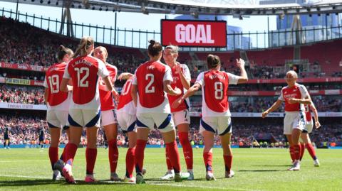 Arsenal women celebrate scoring a goal at Emirates Stadium