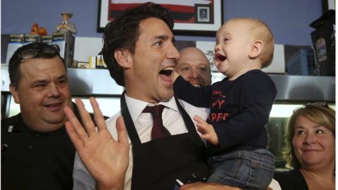 Justin Trudeau with a baby