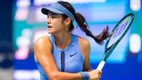 Emma Raducanu hits a forehand