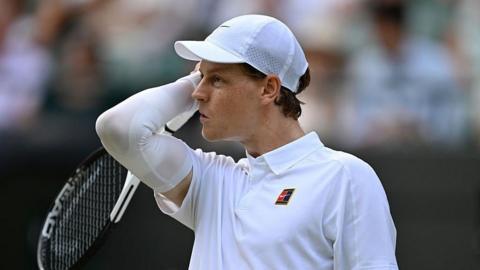 Jannik Sinner reacts during his quarter-final win at Wimbledon