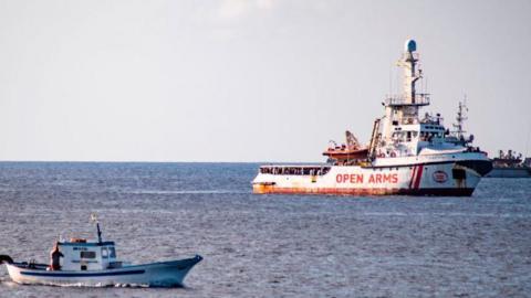 A Spanish migrant rescue boat waits off the coast of the Italian island of Lampedusa on August 17, 2019