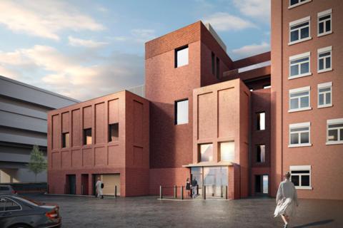 Artist impression Of Mayflower Theatre's proposed rehearsal studio development. It is a large red brick modern building.