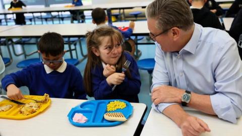 Starmer with kids eating meals