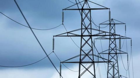 Two pylons against a blue sky