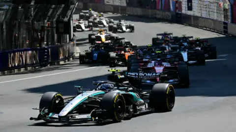 Kimi Antonelli leads the field into the first corner of the Monaco Grand Prix