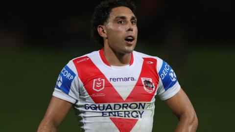 Tyrell Sloan in action for St George Illawarra in the club's white home shirt with red V on the chest