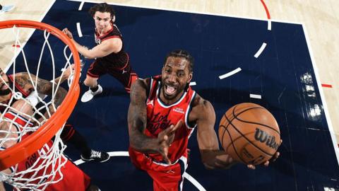 Kawhi Leonard jumps towards the basket