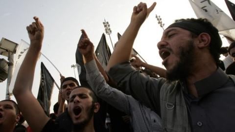 Supporters and members of hardline Islamist group of Ansar al-Sharia shout slogans during a demonstration against a film mocking Islam in Benghazi (24 September 2012)