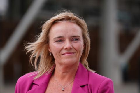 Sandie Peggie, with shoulder length fair hair, wearing a pink jacket