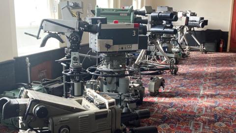 Row of old TV cameras