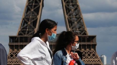 Women near the Eiffel Tower in Paris