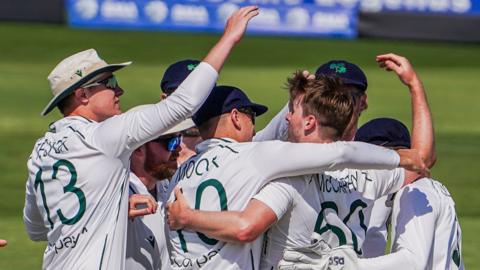 Ireland players celebrate taking an Afghanistan wicket