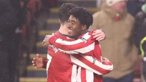 Andre Brooks celebrates his goal against Oxford United