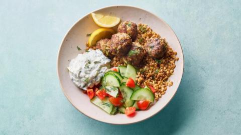 Greek-style turkey meatball grain bowl with spelt and tzatziki