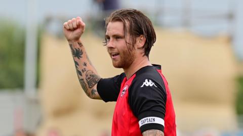 Tyler Harvey celebrating after scoring two late goals to win against Chelmsford City