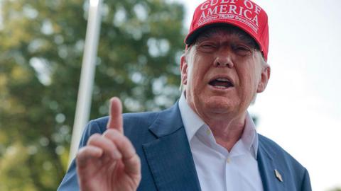 US President Donald Trump speaks to reporters on the South Lawn before boarding Marine One and departing the White House on 1 July, 2025 in Washington, DC.
