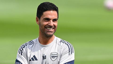 Mikel Arteta, pictured smiling during Arsenal training