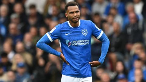 Portsmouth winger Josh Murphy has his hands on his hips