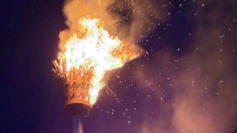 A beacon has been set on fire at night