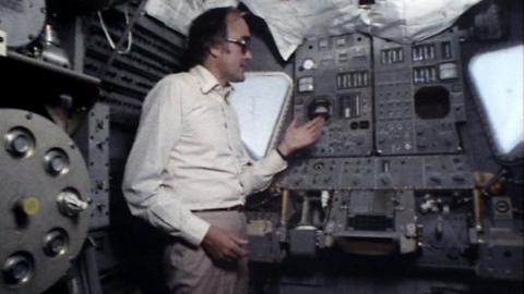 James Burke showing off the lunar module computer.