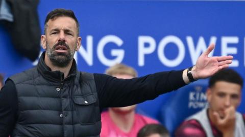 Ruud van Nistelrooy extends his left arm as he gives directions to his players