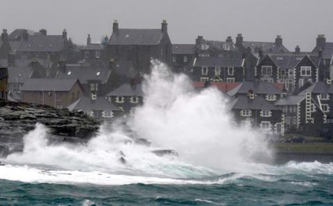 Waves crash off rocks in Lerwick