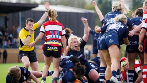 Bristol players put their arms in the air to celebrate a try against Gloucester-Hartpury