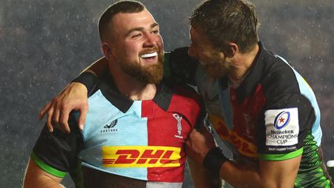 George Head smiles after scoring a try for Harlequins