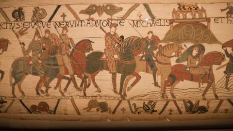 A part of the Bayeux Tapestry with soldiers on horses