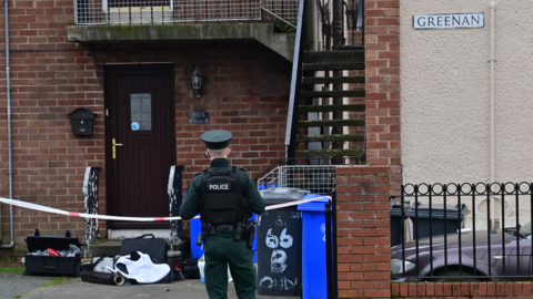 Police at scene of shooting in Greenan, west Belfast