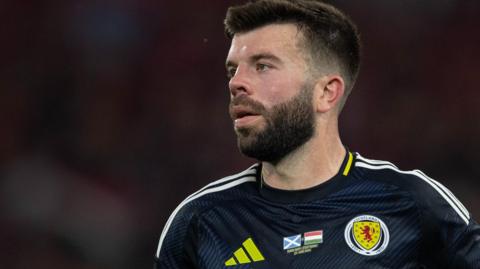 Grant Hanley in action for Scotland