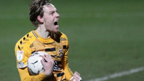 Joe Ironside celebrates his hat-trick for Cambridge United against Cheltenham