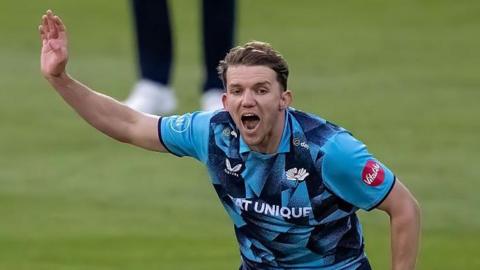 Matt Milnes celebrates a wicket playing for Yorkshire