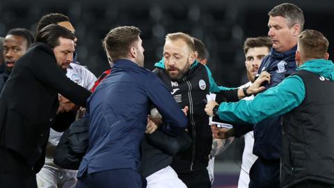 Swansea and Preston players and staff clash