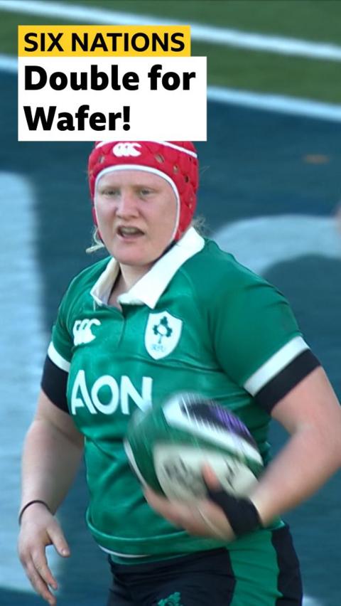 Aoife Wafer holding a rugby ball in her hand 