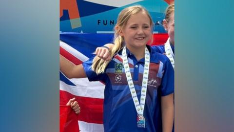 Evie Wilkinson wearing a medal at the European Championships in Madeira