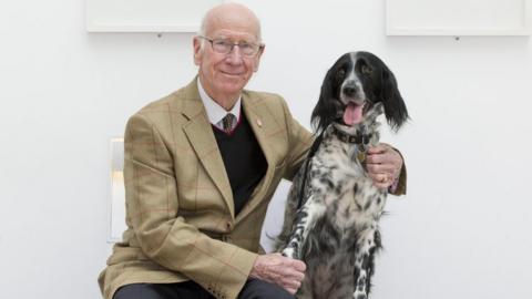 Sir Bobby Charlton meets Eva the dog