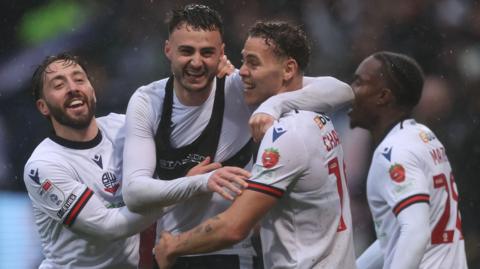 Bolton celebrate Aaron Collins' late winner against Blackpool